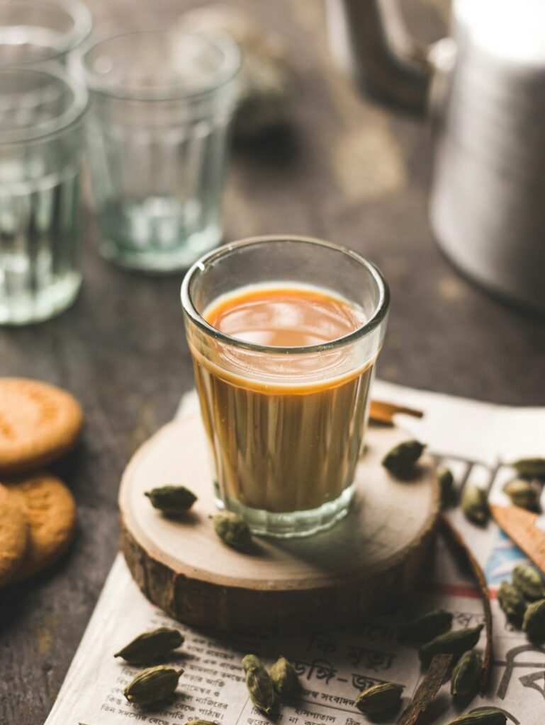 Indian chai in glass cups with masalas to make the tea.